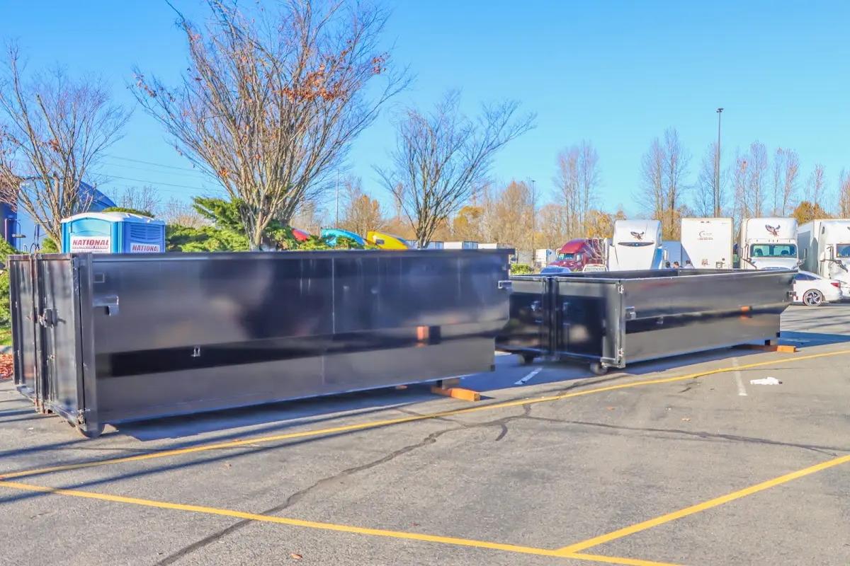 Professional dumpster rental service with roll-off container on residential driveway in South San Jose Hills